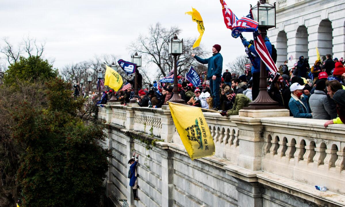  Protesters stand on the veranda of the U.S. Capitol at a rally in Washington on Jan. 6, 2021. (Courtesy of Brandon Drey)