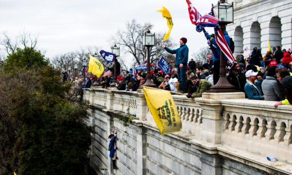 Protesters stand on the veranda of the U.S. Capitol at a rally in Washington, on Jan. 6, 2021. (Courtesy of Brandon Drey)