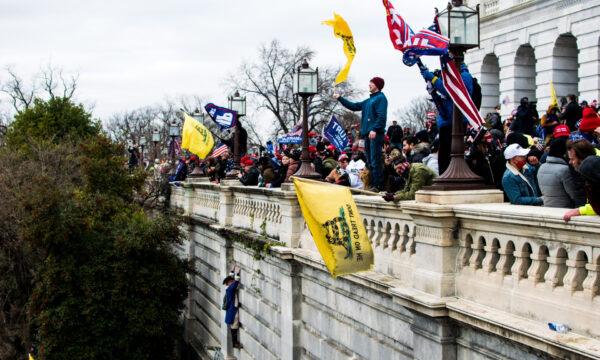 Protesters stand on the veranda of the U.S. Capitol at a rally in Washington on Jan. 6, 2021. (Courtesy of Brandon Drey)