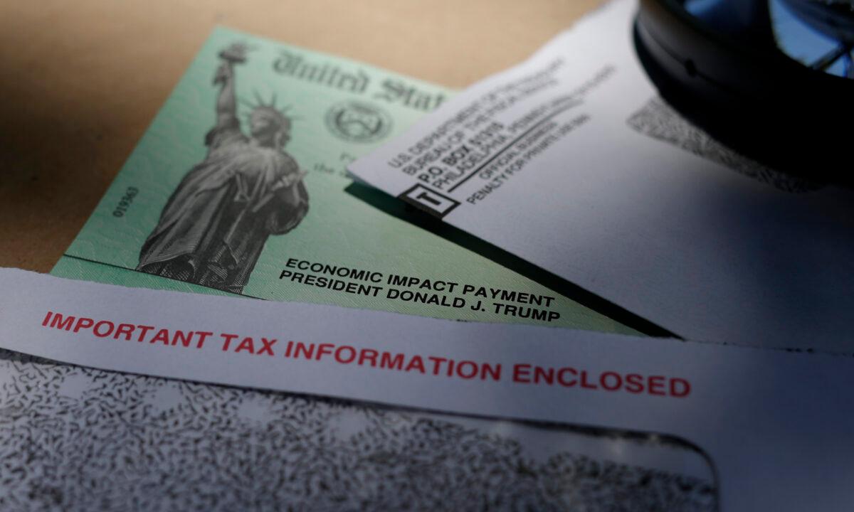  In this April 23, 2020, file photo, President Donald Trump's name is seen on a stimulus check issued by the IRS to help combat the adverse economic effects of the COVID-19 outbreak, in San Antonio. (Eric Gay/AP Photo File)