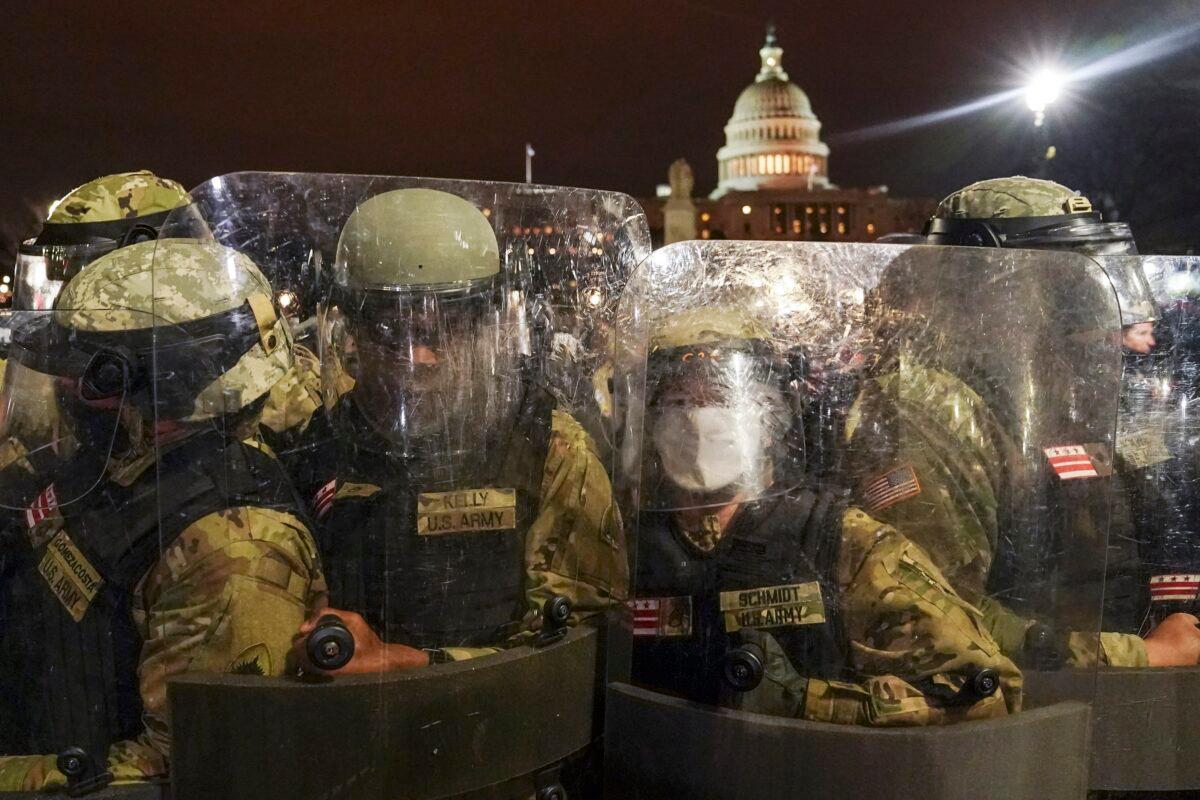 D.C. National Guard personnel stand outside the U.S. Capitol in Washington on Jan. 6, 2021. (John Minchillo/AP Photo)