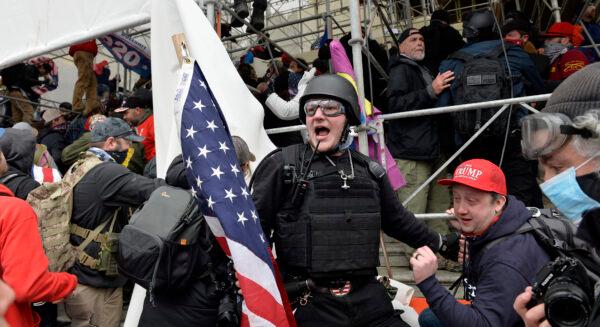 A man calls on people to enter the Capitol building in Washington, on Jan. 6, 2021. (Joseph Prezioso/AFP via Getty Images)