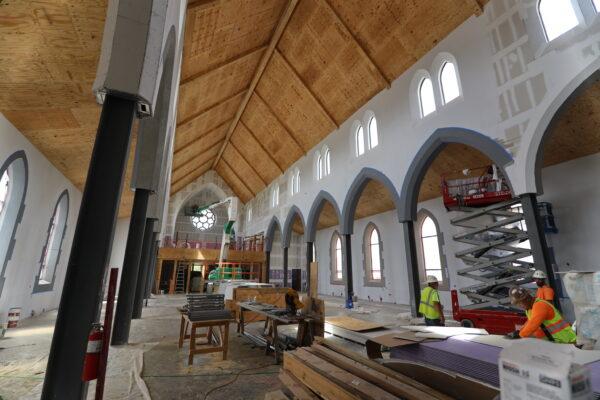 The interior of Christ the King Chapel under construction. The lavender-colored drywall, showed front right, was installed two layers thick throughout the chapel, with three layers in the choir loft. (Christendom College)