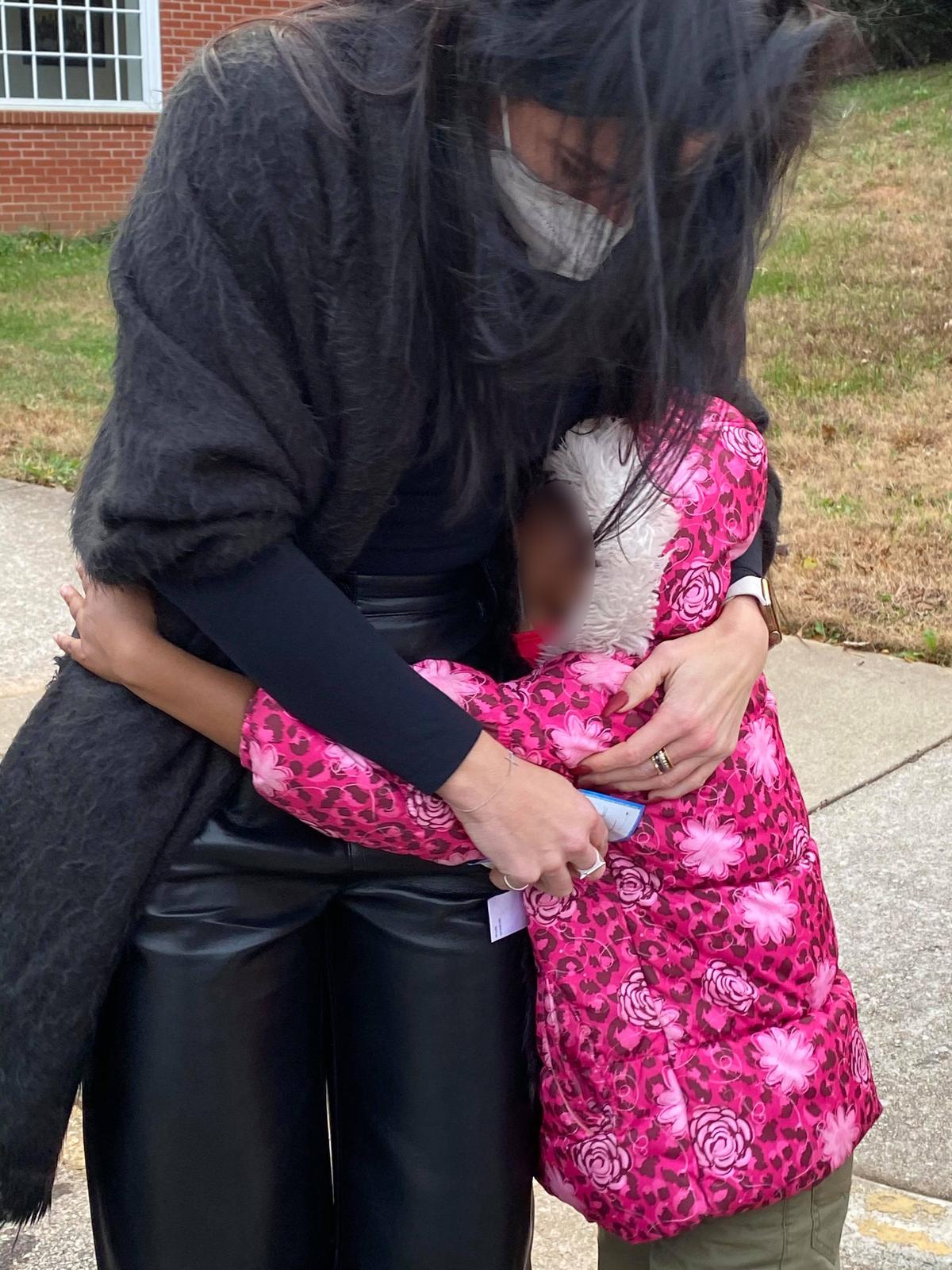 The little girl hugging her school principal. (Courtesy of <a href="https://www.facebook.com/monet.bartell.7">Monet Bartell</a>)