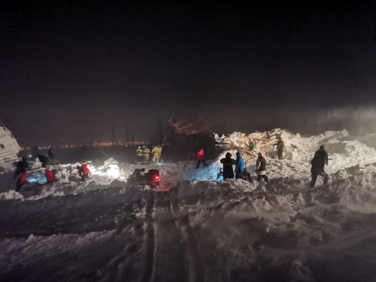 Rescuers and volunteers take part in a search operation after an avalanche hit a ski resort in the Siberian city of Norilsk, Russia, on Jan. 9, 2021. (Russian Emergencies Ministry/Handout via Reuters)