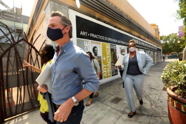 California Gov. Gavin Newsom (L front) takes a tour of businesses in the Leimert Park neighborhood of Los Angeles, on June 3, 2020. (Genaro Molina/Pool/AFP via Getty Images)