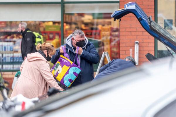 Shoppers outside a branch of Morrisons in Portsmouth, United Kingdom, on Dec. 21, 2020. (Andrew Hasson/Getty Images)