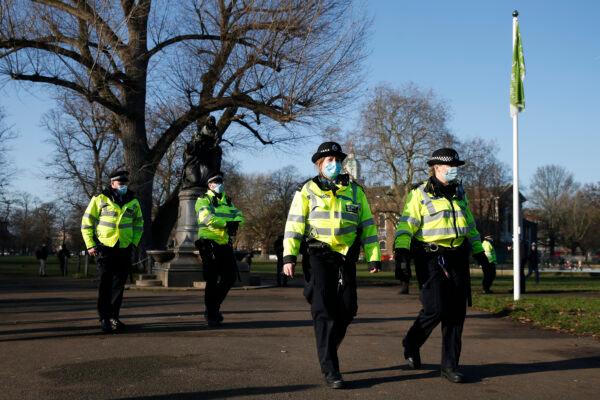Police maintain a presence at Clapham Common during the anti-lockdown demonstration in London, England, on Jan. 9, 2021. (Hollie Adams/Getty Images)