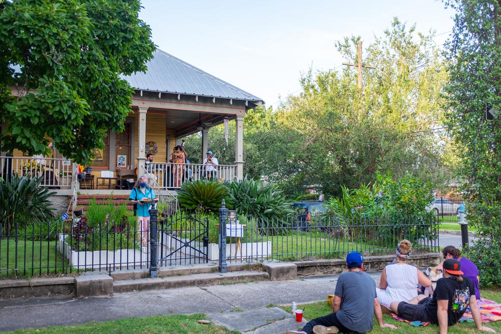 Neighbors enjoy a front porch concert in New Orleans in July 2020. (William A. Morgan/Shutterstock)