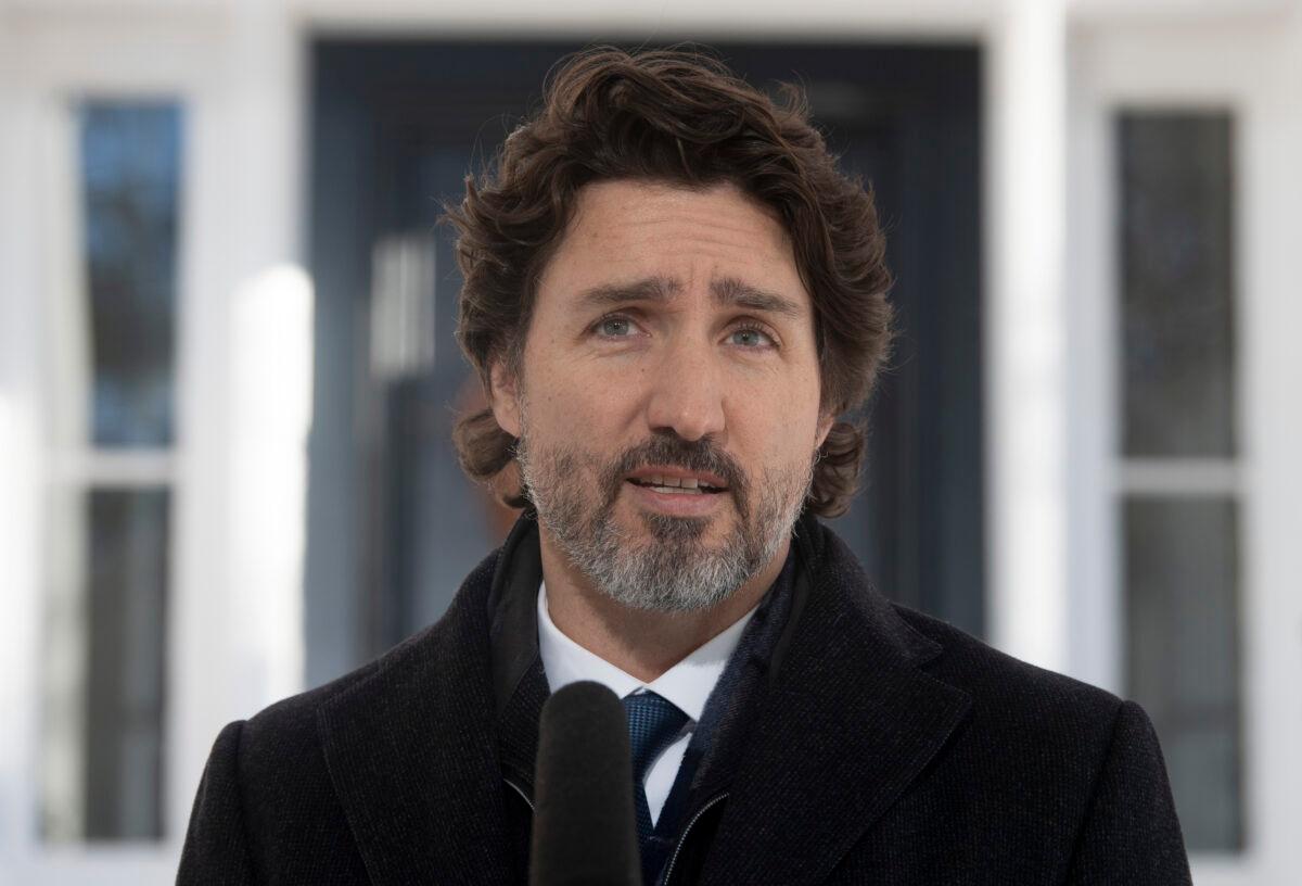 Prime Minister Justin Trudeau delivers his opening remarks during a news conference outside Rideau cottage in Ottawa on Jan. 8, 2021. (Adrian Wyld/The Canadian Press)