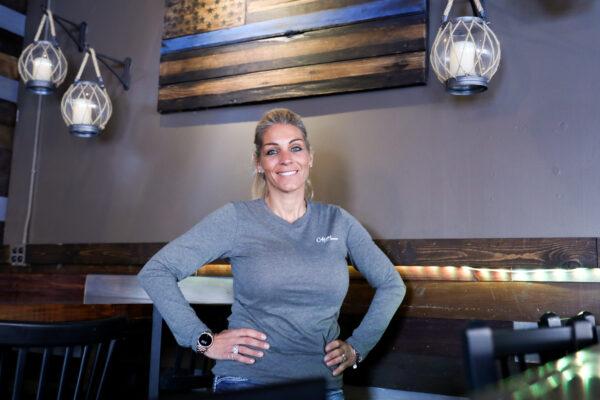 Lisa Monet Zarza, owner of Alibi Drinkery in her bar in the Minneapolis metropolitan area, Minn., on Dec. 30, 2020. (Charlotte Cuthbertson/The Epoch Times)