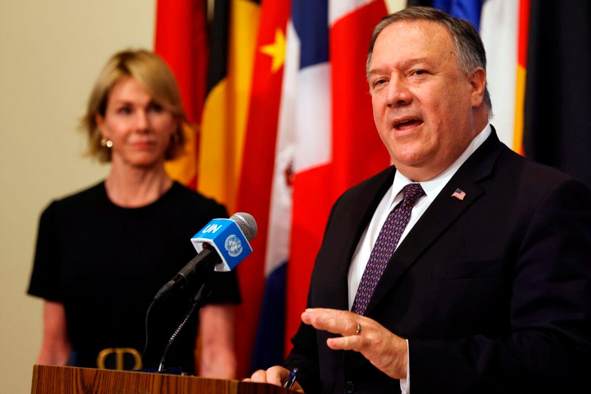 U.S. Secretary of State Mike Pompeo is flanked by U.S. Ambassador to the United Nations Kelly Craft as he speaks to reporters at the United Nations headquarters in New York, on Aug. 20, 2020. (Mike Segar/AFP via Getty Images)