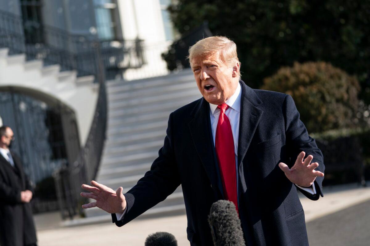 President Donald Trump speaks to reporters on the South Lawn of the White House before boarding Marine One, in Washington on Jan. 12, 2021. (Drew Angerer/Getty Images)