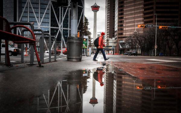 A pedestrian walks through an empty downtown Calgary on Dec. 9, 2020. (The Canadian Press/Jeff McIntosh)