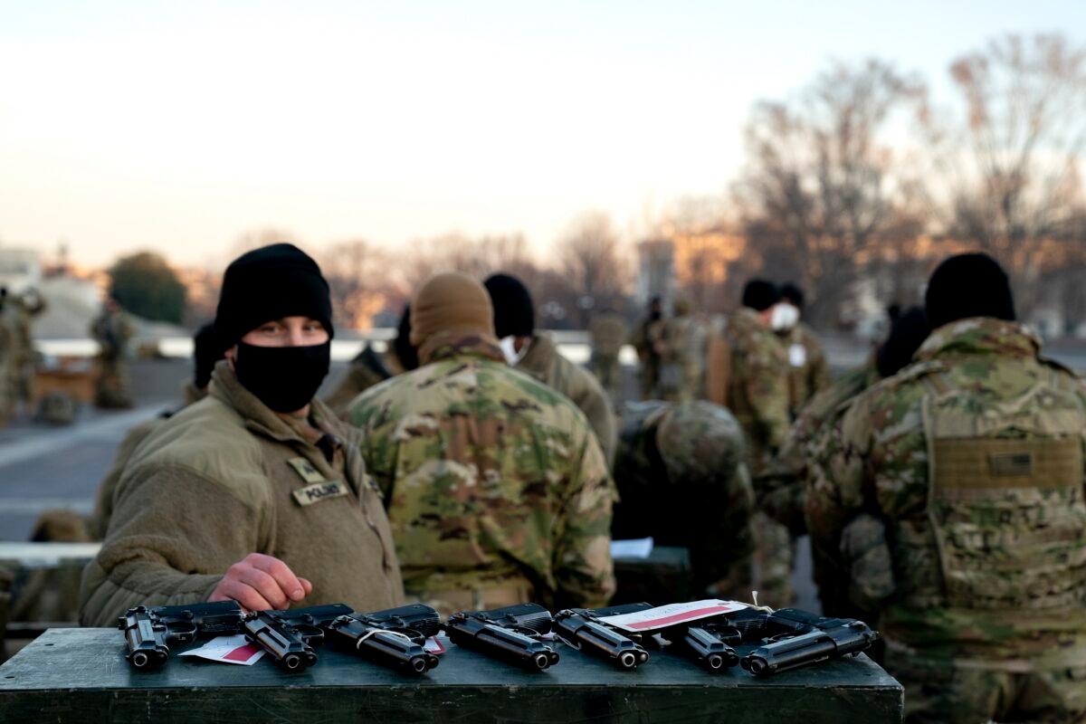 Weapons are distributed to members of the National Guard outside the U.S. Capitol in Washington on Jan. 13, 2021. (Stefani Reynolds/Getty Images)