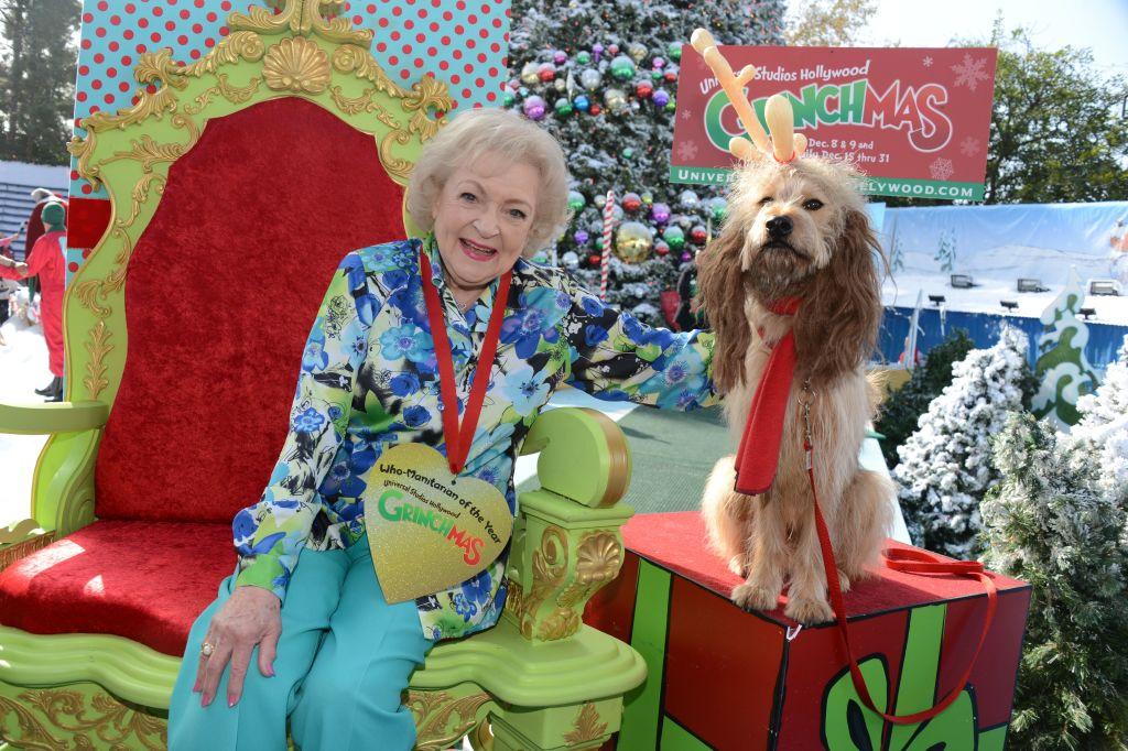 Betty White poses with "Max," the Grinch's canine sidekick, at the preview opening of the "Grinchmas" holiday celebration at Universal Studios Hollywood in Universal City, Calif., on Dec. 6, 2012. (ROBYN BECK/AFP via Getty Images)
