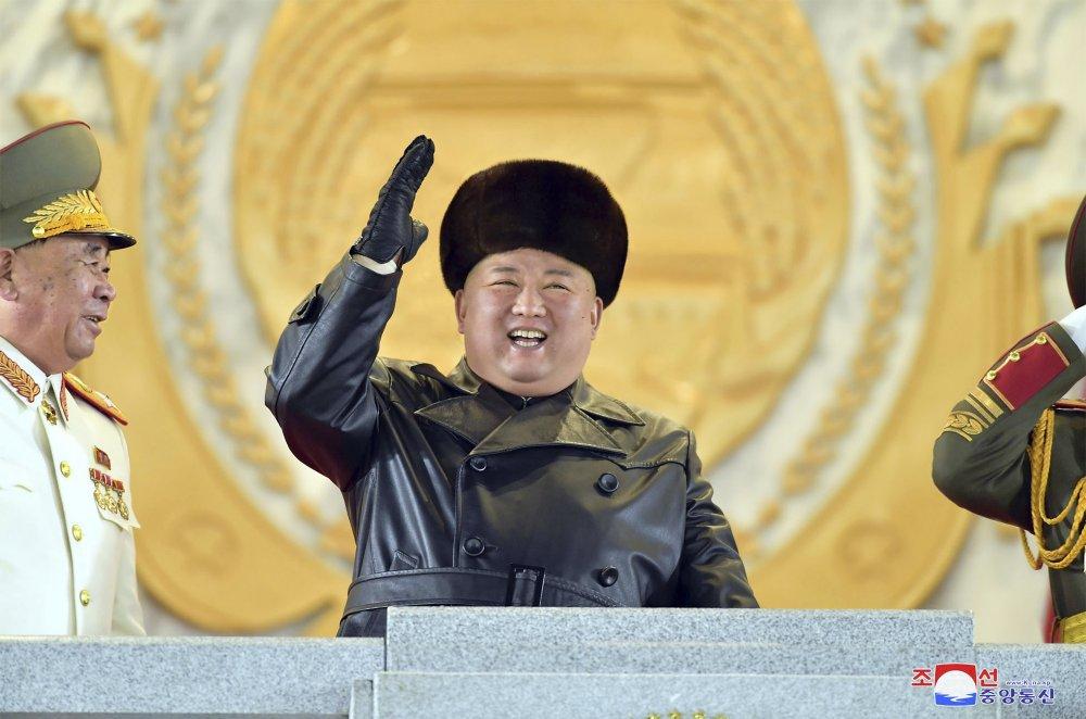 In this photo provided by the North Korean government, North Korean leader Kim Jong Un waves as Kim attended a military parade, marking the ruling party congress, at Kim Il Sung Square in Pyongyang, North Korea Thursday, Jan. 14, 2021.  (Korean Central News Agency/Korea News Service via AP)