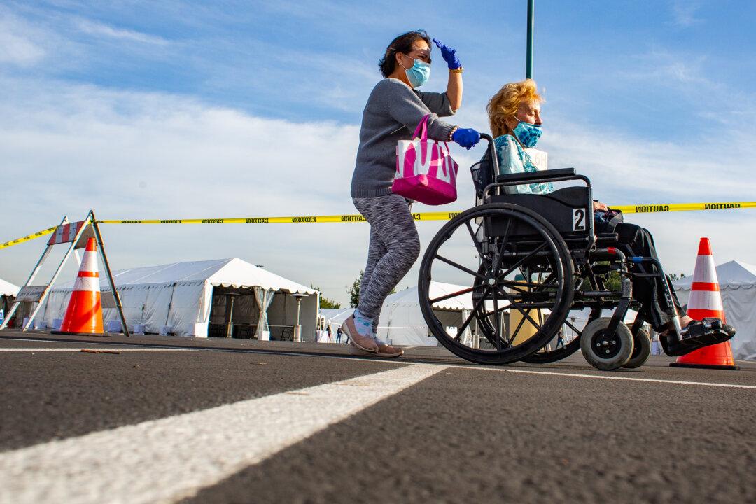 Seniors, Health Workers Flood Disneyland for Vaccine Despite Tech Troubles