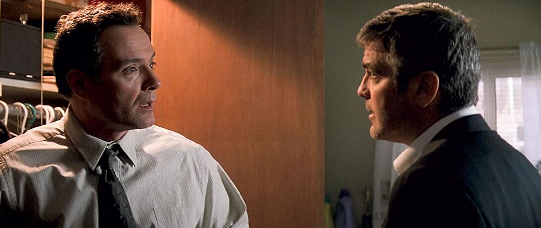 Gene Clayton (Sean Cullen, L) and brother Michael Clayton (George Clooney) argue about whether Michael's got his life together, in "Michael Clayton." (Warner Bros.)