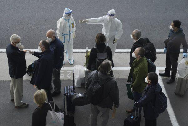 The WHO team arrives in Wuhan city to investigate pandemic origins, in Hubei Province, China, on Jan. 14, 2021. (AP Photo/Ng Han Guan)