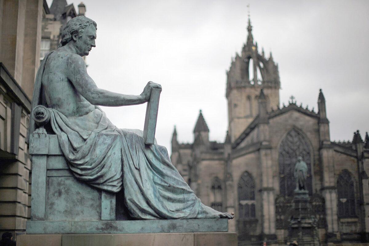 The statue of philosopher David Hume on the Royal Mile, which runs from Edinburgh Castle at the top down to Holyrood Palace in Edinburgh, Scotland, on Feb. 21, 2012. (Jeff J Mitchell/Getty Images)