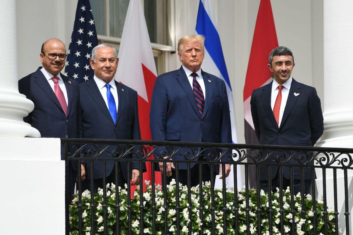 (L-R) Bahrain Foreign Minister Abdullatif al-Zayani, Israeli Prime Minister Benjamin Netanyahu, President Donald Trump, and UAE Foreign Minister Abdullah bin Zayed Al-Nahyan pose from the Truman Balcony at the White House before they participate in the signing of the Abraham Accords where the countries of Bahrain and the United Arab Emirates recognized Israel, in Washington on Sept. 15, 2020. (Saul Loeb/AFP via Getty Images)