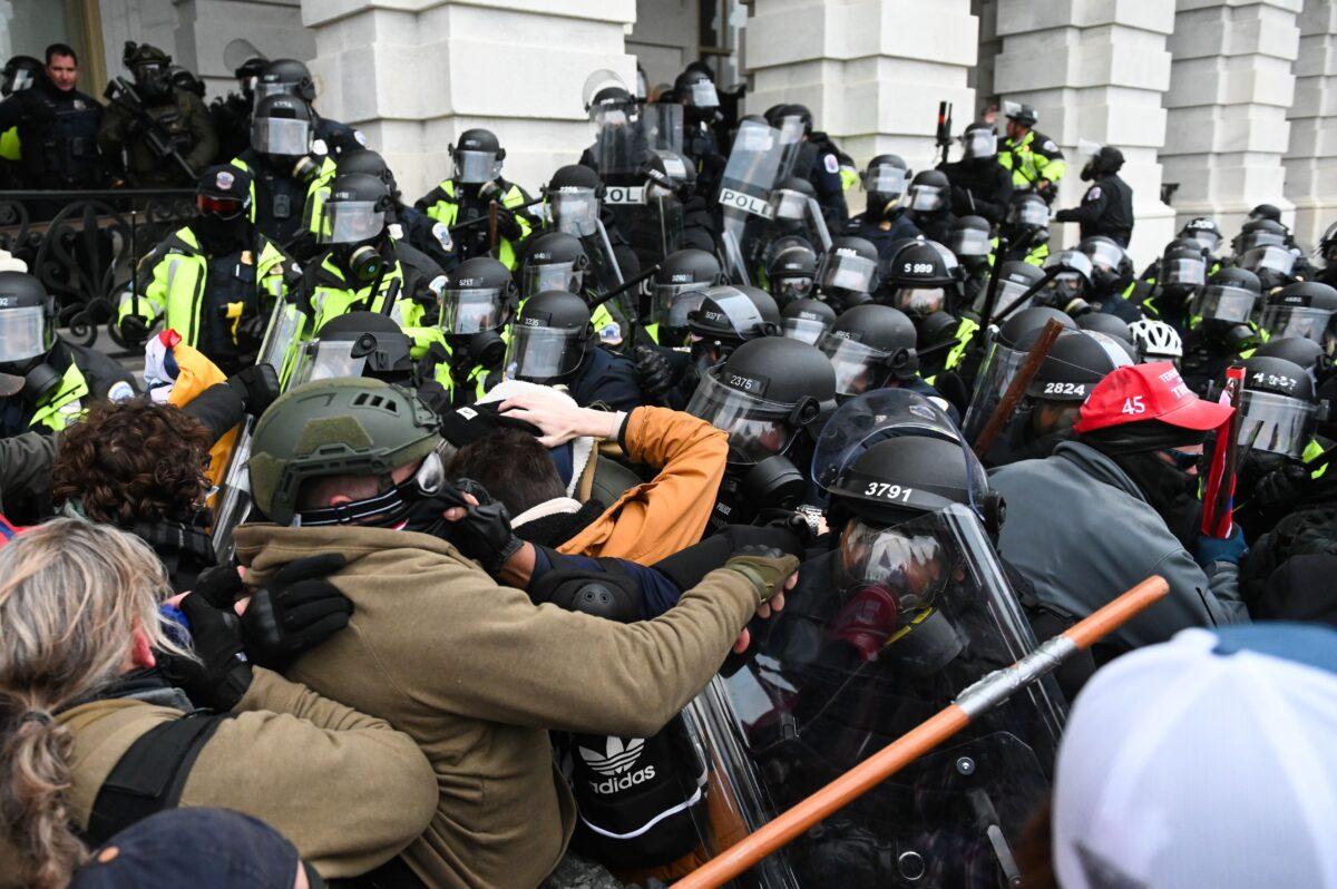 Demonstrators clash with police officers outside the U.S. Capitol building in Washington on Jan. 6, 2021. (Roberto Schmidt/AFP via Getty Images)