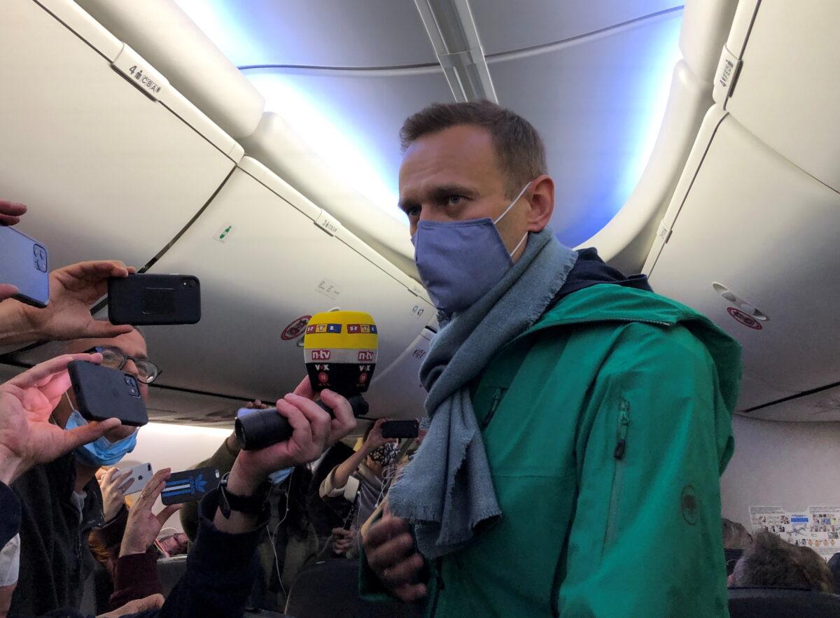 Russian opposition leader Alexei Navalny is seen on board a plane before the departure for the Russian capital Moscow at an airport in Berlin, Germany, on Jan. 17, 2021. (Polina Ivanova/Reuters)