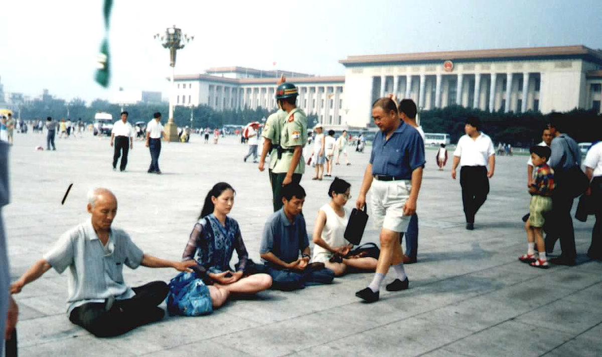 Angel and other Falun Gong practitioners meditate in Tiananmen Square, in Beijing, in 2001. (Courtesy of Angel)