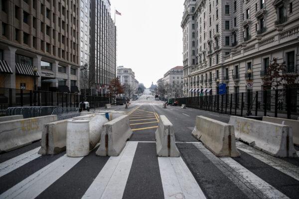 Extra security barriers block the roads at F and 14th streets in Washington on Jan. 15, 2021. (Charlotte Cuthbertson/The Epoch Times)