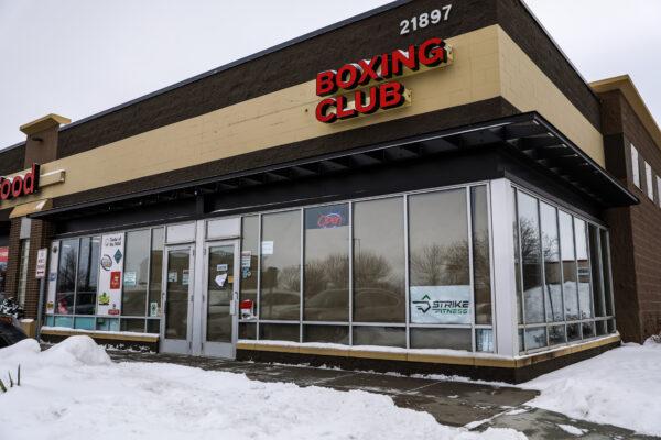 STRIKE Fitness boxing club has papered-over windows to stop people from seeing inside and calling the authorities, in Rogers, Minn., on Dec. 30, 2020. (Charlotte Cuthbertson/The Epoch Times)