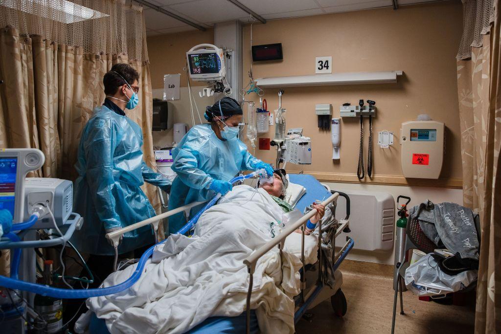 Health care workers use a continuous positive airway pressure machine on a COVID-19 patient at Providence St. Mary Medical Center in Apple Valley, Calif., on Jan. 11, 2021. (Ariana Drehsler/AFP via Getty Images)