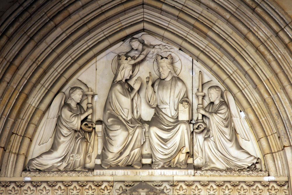 Mary's coronation in heaven is depicted on a tympanum (a decorative arch above an entrance, door, or window). (Zvonimir Atletic/Shutterstock.com)