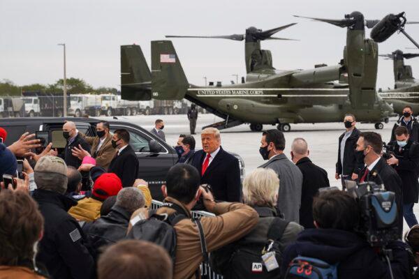 President Donald Trump greets supporters at Valley International Airport in Harlingen, Texas, on Jan. 12, 2021. (Go Nakamura/Getty Images)