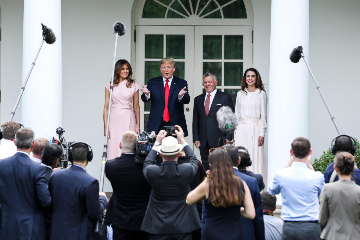 President Donald Trump and First Lady Melania Trump participate in the arrival of King Abdullah II bin Al-Hussein and Queen Rania Al Abdullah of the Hashemite Kingdom of Jordan at the White House in Washington on June 25, 2018. (Samira Bouaou/The Epoch Times)