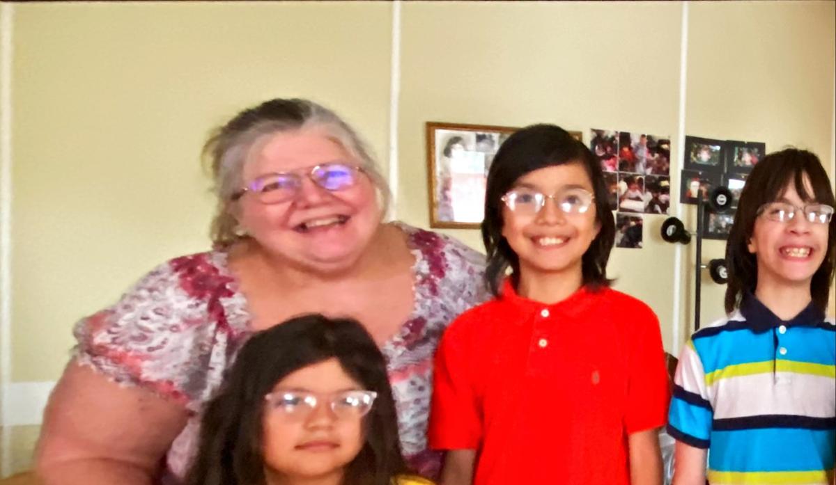 Carol Johnson with three of her grandchildren. (Courtesy of Peggy Fox of <a href="https://www.dominionenergy.com/">Dominion Energy</a>)