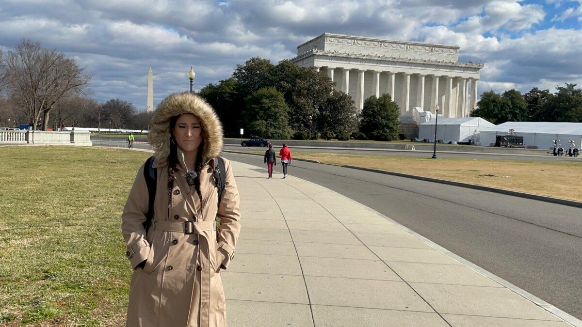 Megan Marie Randall, a first-time tourist from Texas, described the city as “a maze of fences” and “a military camp,” in Washington on Jan. 17, 2021. (Terri Wu / The Epoch Times)