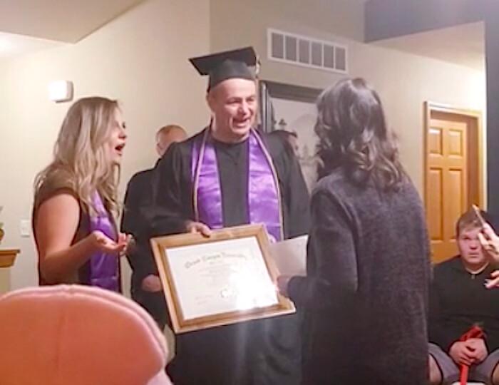 Mike surprises his daughter, Taleigh (L), and wife, Carrie (R), with his college degree (Courtesy of <a href="https://www.facebook.com/mloven">Mike Loven</a>)