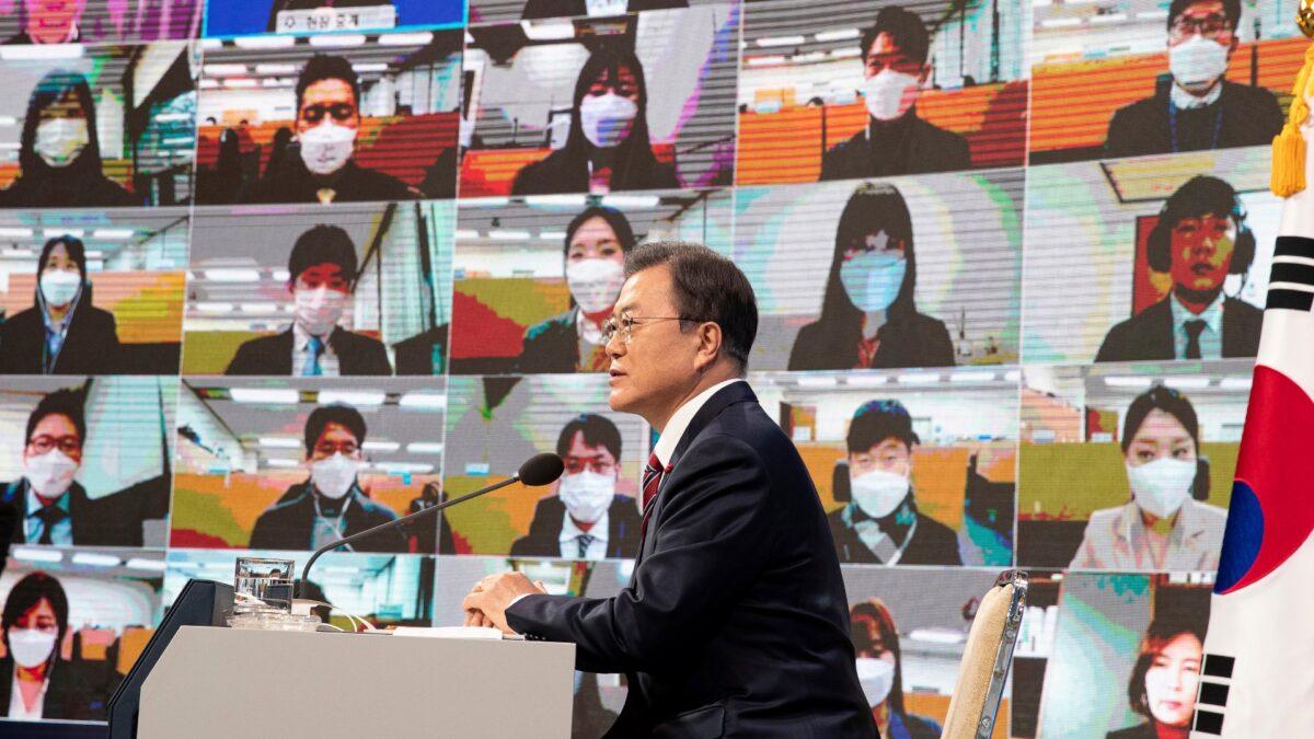 South Korean President Moon Jae-in speaks during an online New Year press conference with local and foreign journalists at the Presidential Blue House in Seoul, South Korea, on Jan. 18, 2021. (Jeon Heon-kyun/Pool Photo via AP)