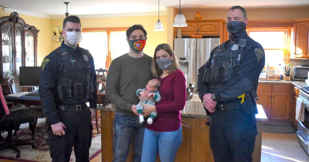 Officers Thomas Bell and James Knight with Gina and Noberto Chaves, holding baby Lucas. (Courtesy of <a href="https://www.cranfordnj.org/cranford-police-department">Cranford Police Department</a>)