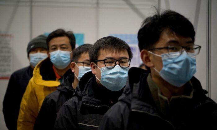 2 More Chinese Cities Go Under Lockdown, as Beijing Mandates 4-Week Quarantine for Travelers