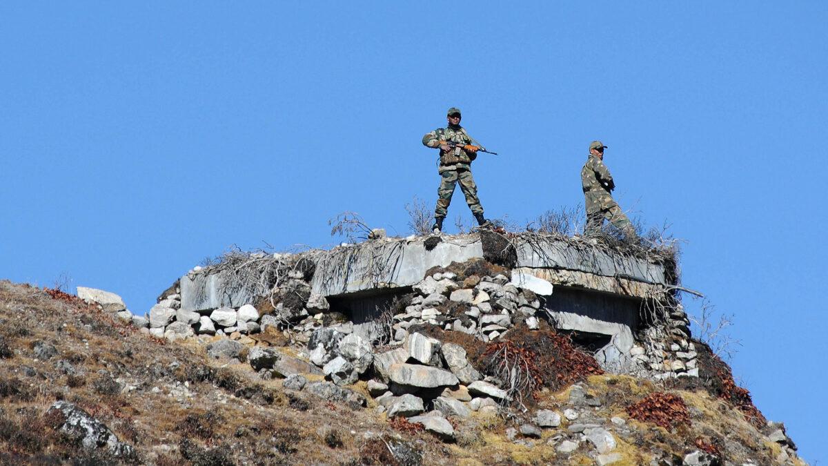 Indian army personnel stand guard at Bumla pass at the India-China border in Arunachal Pradesh on Oct. 21, 2012. According to Indian media reports, the Chinese have built 101 houses in the state, 2.5 miles inside Indian territory. (Biju Boro/AFP via Getty Images)