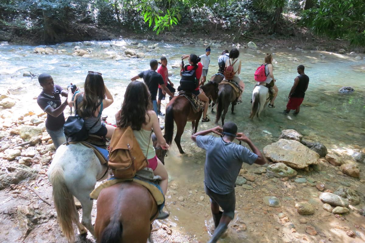 Swapping hiking boots for saddles, travelers ride horses to see the 150-foot Salto El Limón. (Kevin Revolinski)