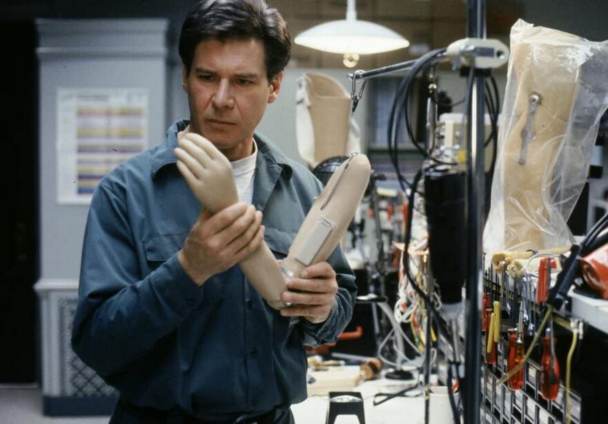 Dr. Richard Kimble (Harrison Ford) examines a prosthetic limb for clues, in “The Fugitive.” (Warner Bros.)