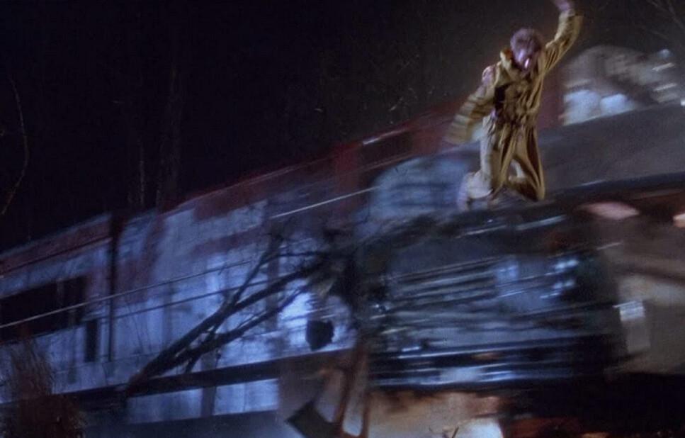 Doctor Richard Kimble (Harrison Ford) jumping from a moving train to escape execution, in “The Fugitive.” (Warner Bros.)