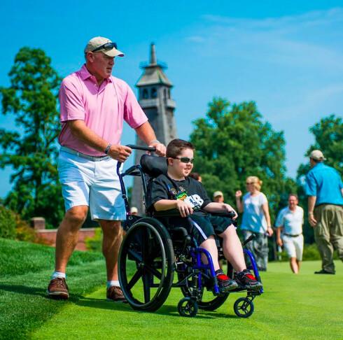 Marty Lyons and a young friend at the Marty Lyons Foundation's 2015 30th Annual Celebrity Golf Classic in Old Westbury, N.Y. (Courtesy of the Marty Lyons Foundation)