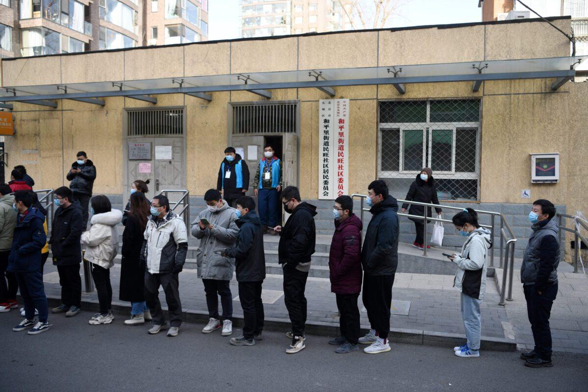 Residents line up outside a community center to be vaccinated against COVID-19 in Beijing, China on Jan. 12, 2021. (Greg Baker/AFP via Getty Images)