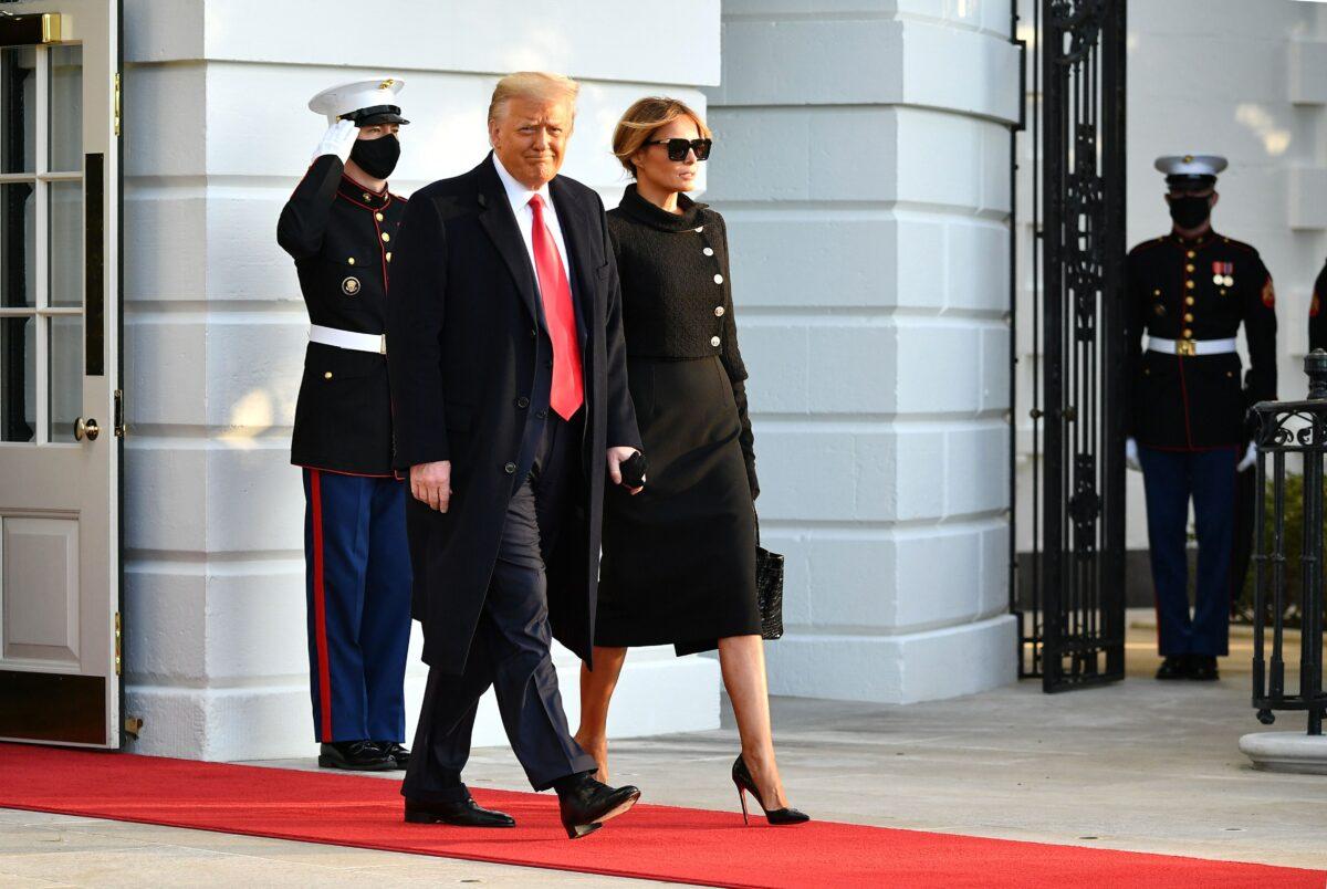 President Donald Trump and First Lady Melania make their way to board Marine One before departing from the South Lawn of the White House in Washington, on Jan. 20, 2021. (Mandel Ngan/AFP via Getty Images)