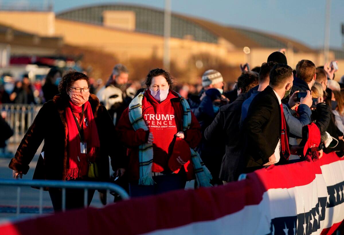 Supporters of President Donald Trump gather at Joint Base Andrews in Maryland for Trump's departure on Jan. 20, 2021. (Alex Edelman/AFP via Getty Images)