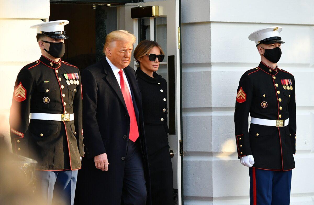 President Donald Trump and First Lady Melania make their way to board Marine One before departing from the South Lawn of the White House on Jan. 20, 2021. (Mandel Ngan/AFP via Getty Images)